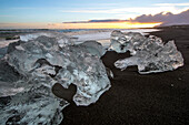 Ice from the Jokulsarlon glacier lagoon washed up on a black sand beach.