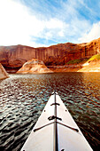 Point of view of a sea kayak in the a desert landscape.