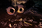 Ancient Mayan pots, a monkey skull, and human bones in the entrance to a underwater cave system.