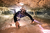 A cave diver in a remote section of cave.