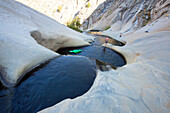 Adventurers explore the Seven Teacups in the Sierra Nevada mountains.