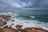 View from the Cape St Blaize Lighthouse of the rocky shore and Atlantic Ocean at Mossel Bay along the Garden Route; Mossel Bay, Western Cape Province, South Africa