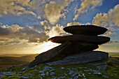 Rocks on Rough Tor bathed in sunset light, on Bodmin Moor, Cornwall, Great Britain.; Rough Tor, near Camelford, Bodmin Moor, Cornwall, southwest England, Great Britain.