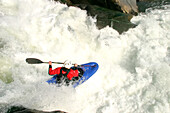 Whitewater kayaker drops a big waterfall.; Great Falls, Potomac River, Virginia/Maryland.
