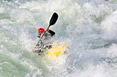 Whitewater kayaker paddles through big rapids.; Potomac River, Maryland and Virginia.
