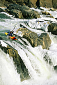 Kayaker at the top of a waterfall, Great Falls on the Potomac River.; GREAT FALLS, POTOMAC RIVER.