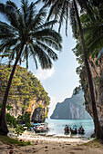 View from the beach of a tropical island with karst rock formations; Phang Nga Bay, Thailand