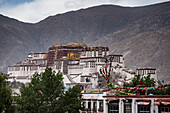Potala Palace with prayer flags, once the Winter Palace of the Dalai Lamas; Lhasa, Tibetan Autonomous Region, Tibet
