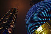 Close-up of buildings with lights outside the Hong Kong Plaza near Xintiandi; Shanghai, China