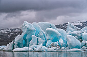 Close-up of the icebergs and blue ice-formations of the Fjallsjokull Glacier viewed from the Fjallsarlon Glacier Lagoon, at the south end of the famous Icelandic glacier Vatnajökull in Southern Iceland; South Iceland, Iceland