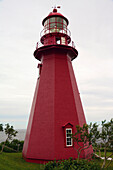 The red La Martre lighthouse on the Gulf of Saint Lawrence.; Quebec, Canada.