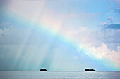 Rainbow over a tiny island; Seychelles