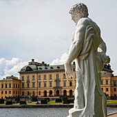 Statue Of A Male Figure And Drottningholm Palace; Stockholm Sweden