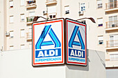 A Sign For A Supermarket On The Side Of A Building; San Fernando Andalusia Spain