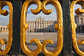 The Royal Palace As Seen Through Gold Painted Details Of A Metal Fence; Madrid Spain
