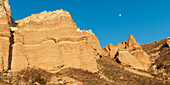 Rock Ridge With The Moon In The Blue Sky; Aktepe Nevsehir Turkey