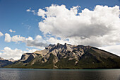 Shoreline Of A Lake Against A Mountain; Banff Alberta Canada