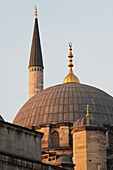 Mosque Of The Valide Sultan With A Domed Roof And Gold Spire; Istanbul Turkey