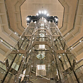 Low Angle View Of An Elevator Encased In Glass; Chicago Illinois United States Of America