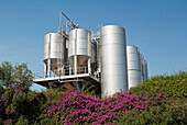 Israel, Jordon Valley, Katzrin, Golan Heights Winery fermenting tanks up on hill above winery