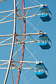 Ferris wheel against blue sky; Tokyo, Japan