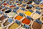 Close up of assorted spices in bags in market; Ferrara, Emilia-Romagna, Italy