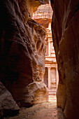 Jordan, El Khazneh seen from natural narrow canyon; Petra