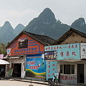 Buildings Covered With Colourful Advertising; Guilin, Guangxi, China