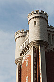 Close Up Of The Top Of A Castle Tower With Blue Sky And Clouds; Toronto, Ontario, Canada