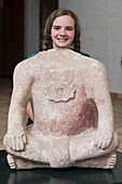A Girl Stands With Her Head Showing Above A Clay Sculpture Of A Headless Body; Copan, Honduras