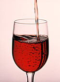 Pouring Red Wine into Glass