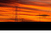 Power Transmission Pylons at Sunset