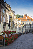 Buildings along cobblestone street, Old Town, Warsaw, Poland.