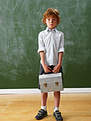 Boy Standing at Blackboard