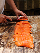 Person Slicing Fish