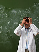 Confused Scientist in Front of Blackboard