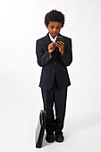 Little Boy Dressed Up as a Businessman Using Cell Phone