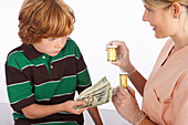 Boy Paying for Medication