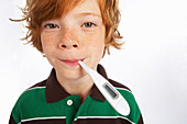 Portrait of Boy Having His Temperature Taken