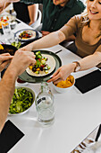 Group of friends eating Mexican food at home