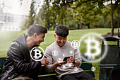 Male friends checking bitcoin crypto currency rates on phone