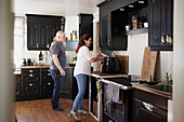 View of mature couple in domestic kitchen