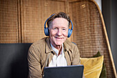 Portrait of senior man in headphones