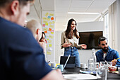 Group of business people attending business meeting in office