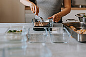 Pregnant woman doing healthy meal prep at home