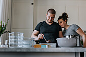 Couple doing healthy meal prep at home