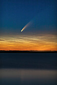 This is Comet NEOWISE (C/2020 F3) over Deadhorse Lake near Hussar in southern Alberta, taken just after midnight on July 10-11, 2020 during its evening appearance. The comet shines just above low noctilucent clouds. The slight wind ruffled the waters enough to prevent the clean reflection I was after.