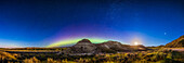 This captures a panorama of the northern sky over the foreground landscape of Dinosaur Provincial Park, Alberta, with the waning Moon rising, and an arc of Northern Lights above the northern horizon. A Kp6 show was forecast for this night but nothing spectacular materialized -- we had just a quiescent arc across the north.