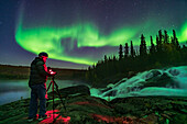 Photographer Stephen Bedingfield is shooting the Northern Lights at the Ramparts waterfalls on the Cameron River, September 8, 2019.