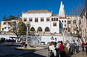 People eating in exterior restaurant and Sintra National Palace, Portugal